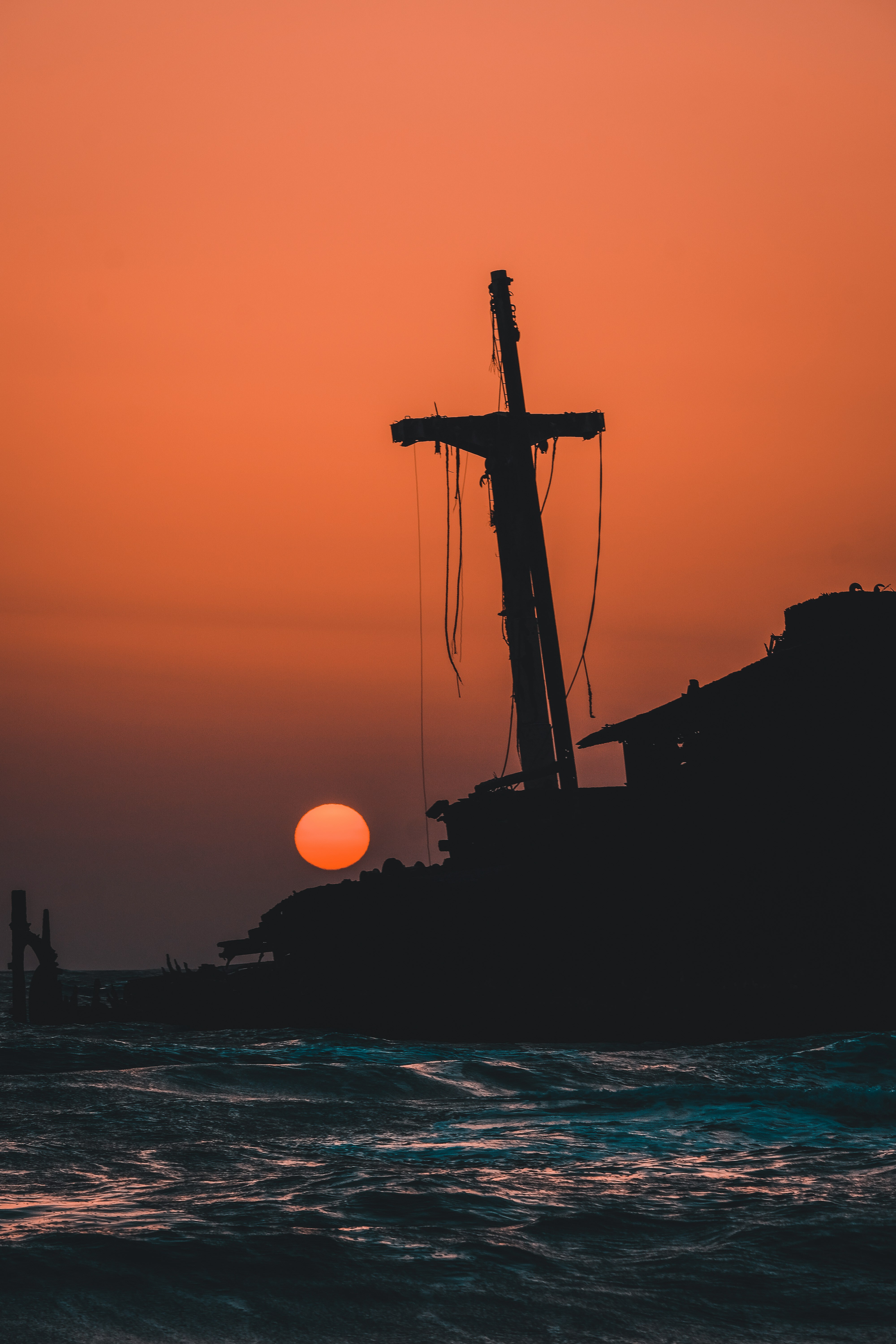 Sunset with cross silhouette