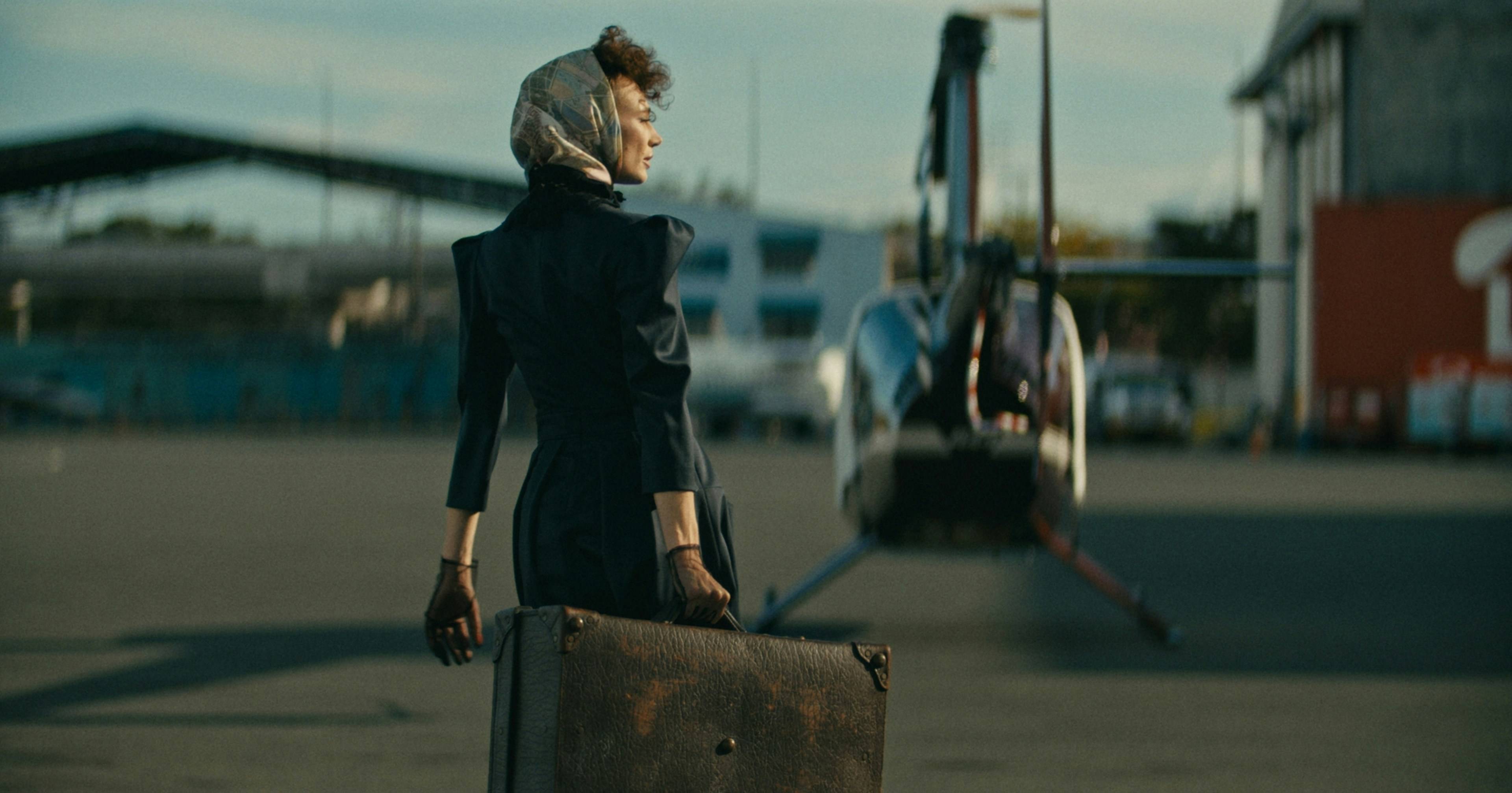 Fashion model with suitcase